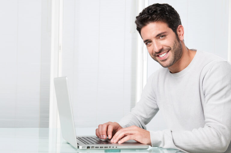 man smiling because he is a successful self-publisher